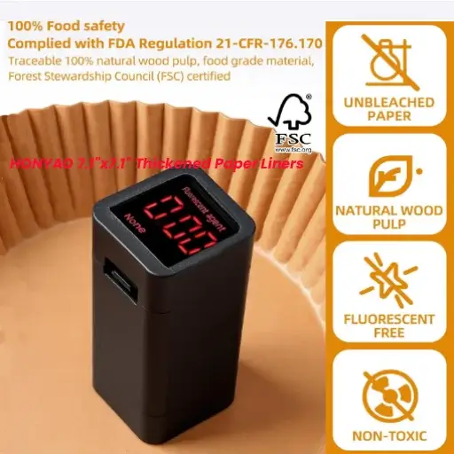 A testing device showing zero fluorescent agents on a brown HONYAO air fryer liner to prove 100% food safety.
